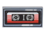 Deler - Sand Blue Tile 1 x 2 with Groove with Cassette Tape with Red and White Striped Label and Black Frame Pattern